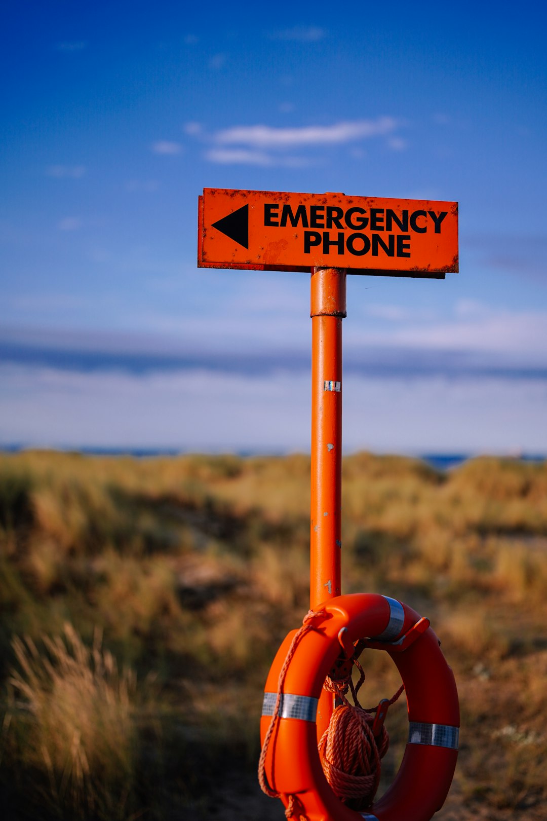 a-life-preserver-with-an-emergency-phone-sign-on-it-n3ph9awp0ni